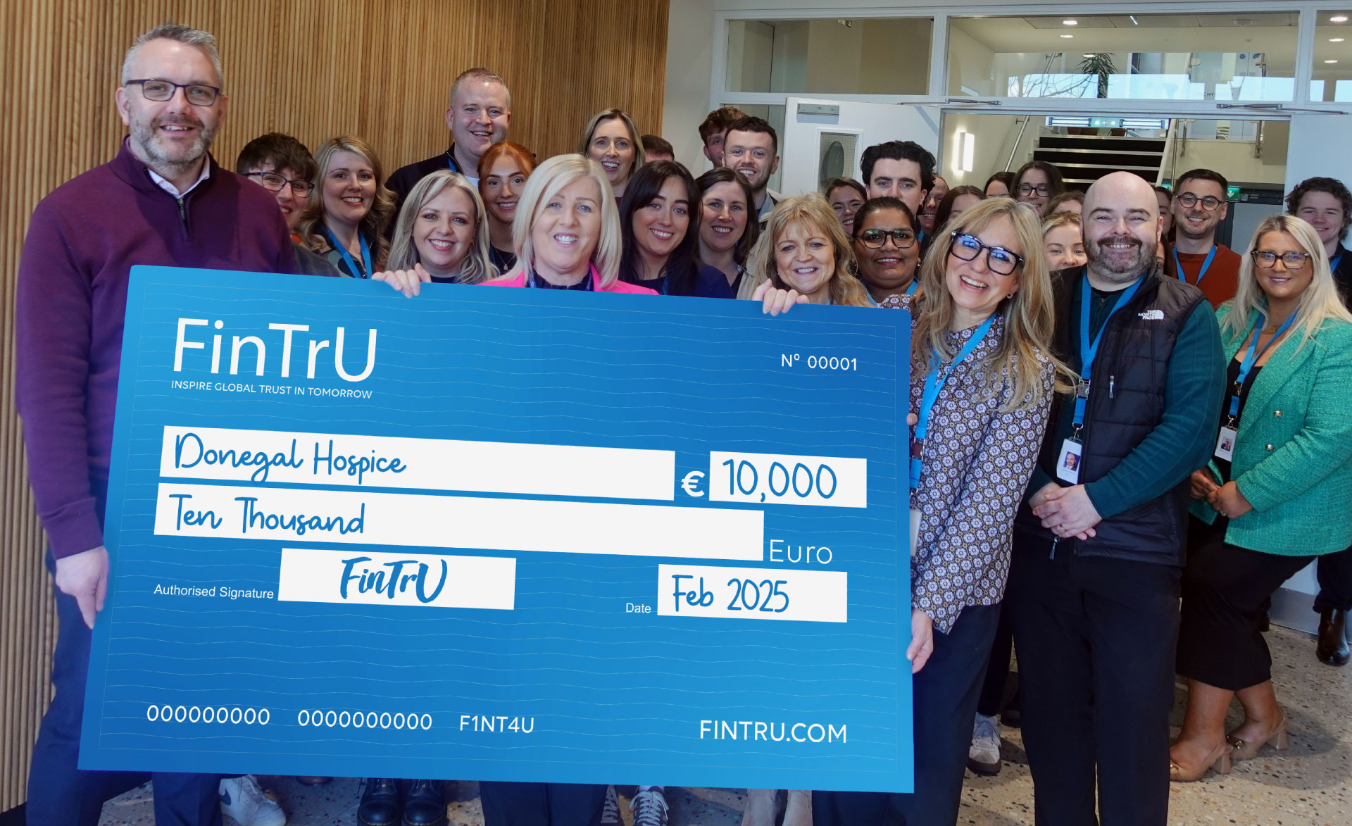 FinTrU employees holding Donegal hospice cheque donation